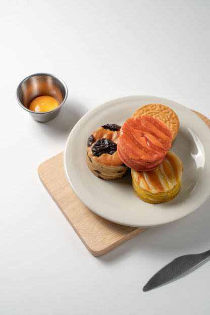 Assorted Mooncake on a plate, shot inside a studio