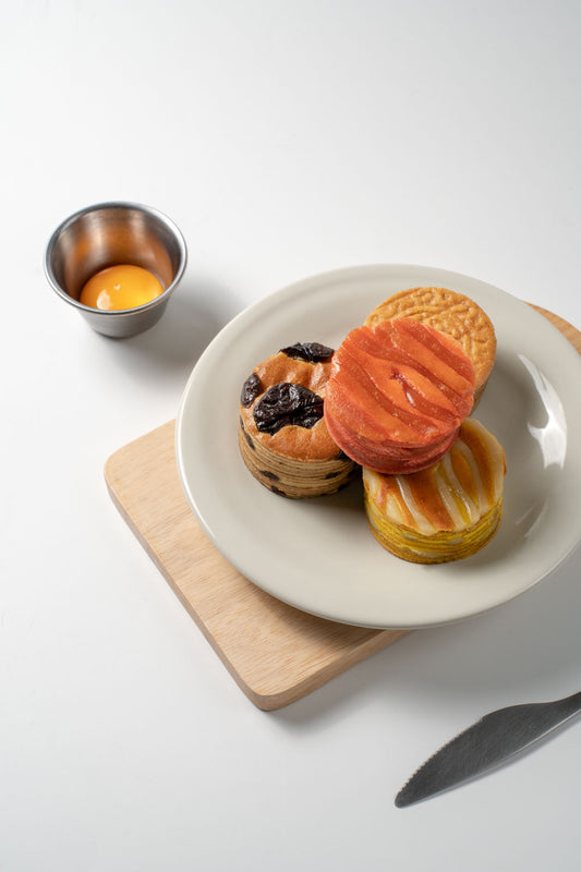 Assorted Mooncake on a plate, shot inside a studio